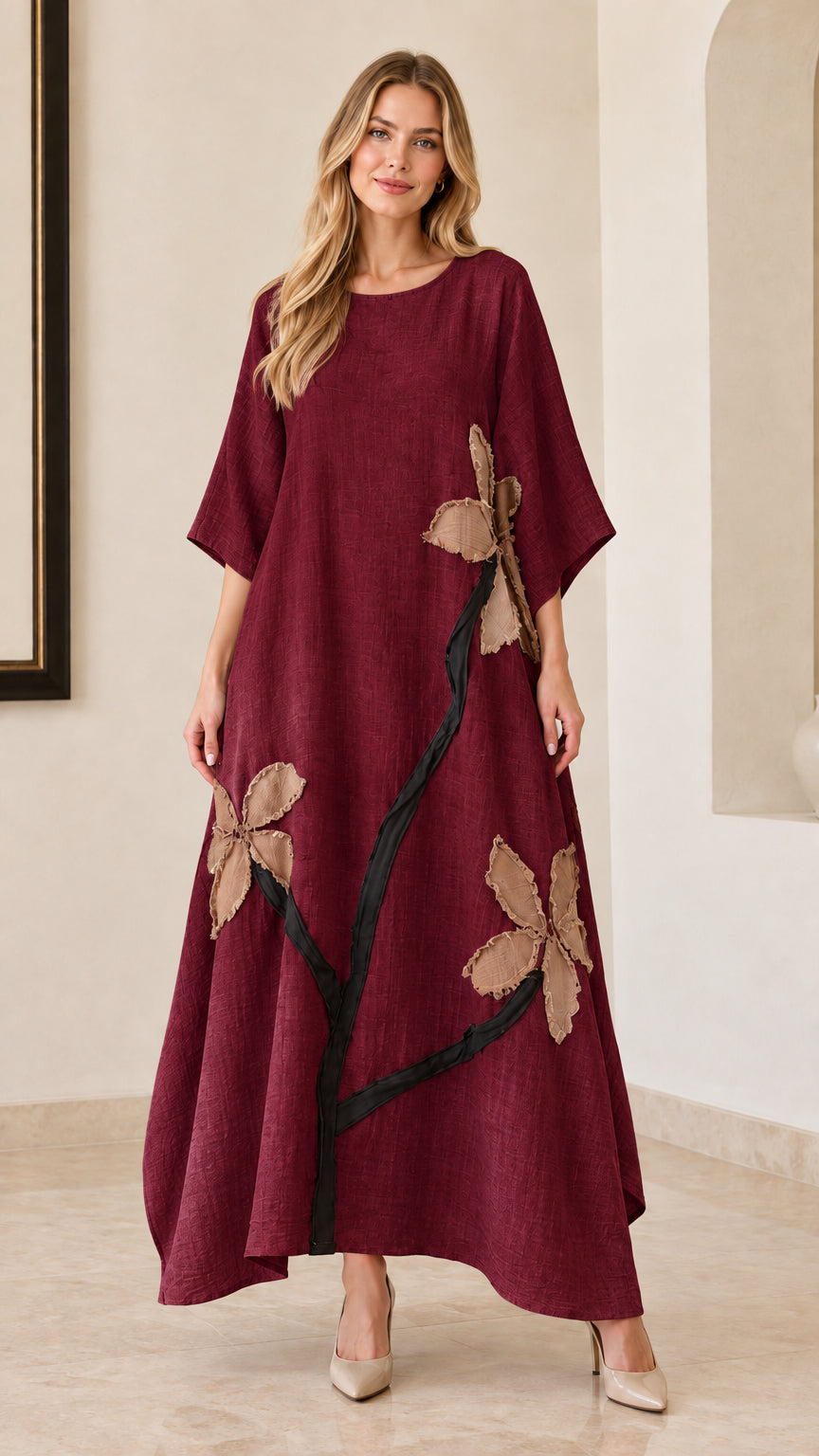Woman wearing burgundy wine red floral appliqué maxi dress
