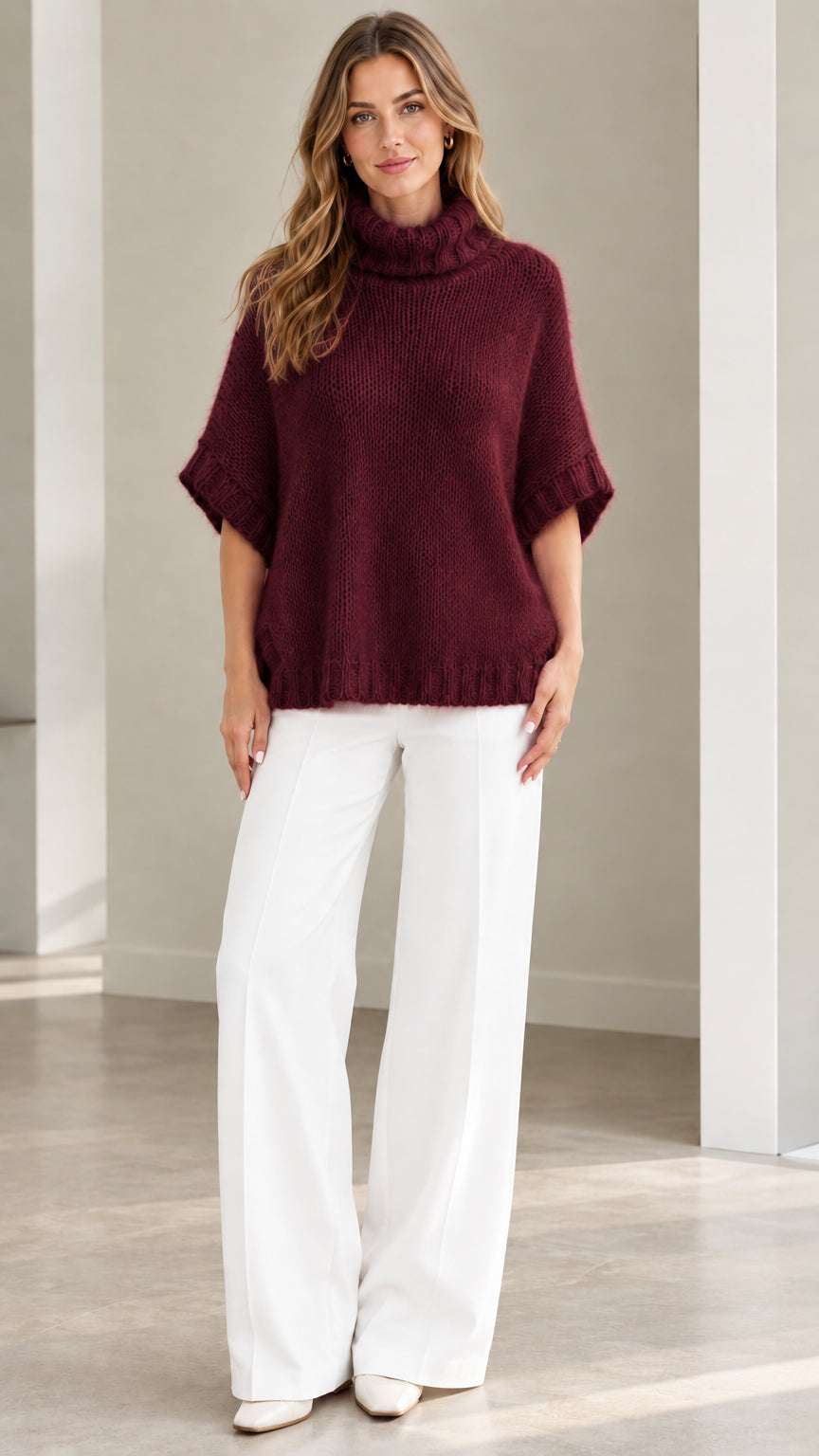 Model wearing Burgundy wine short sleeve turtleneck knit poncho top