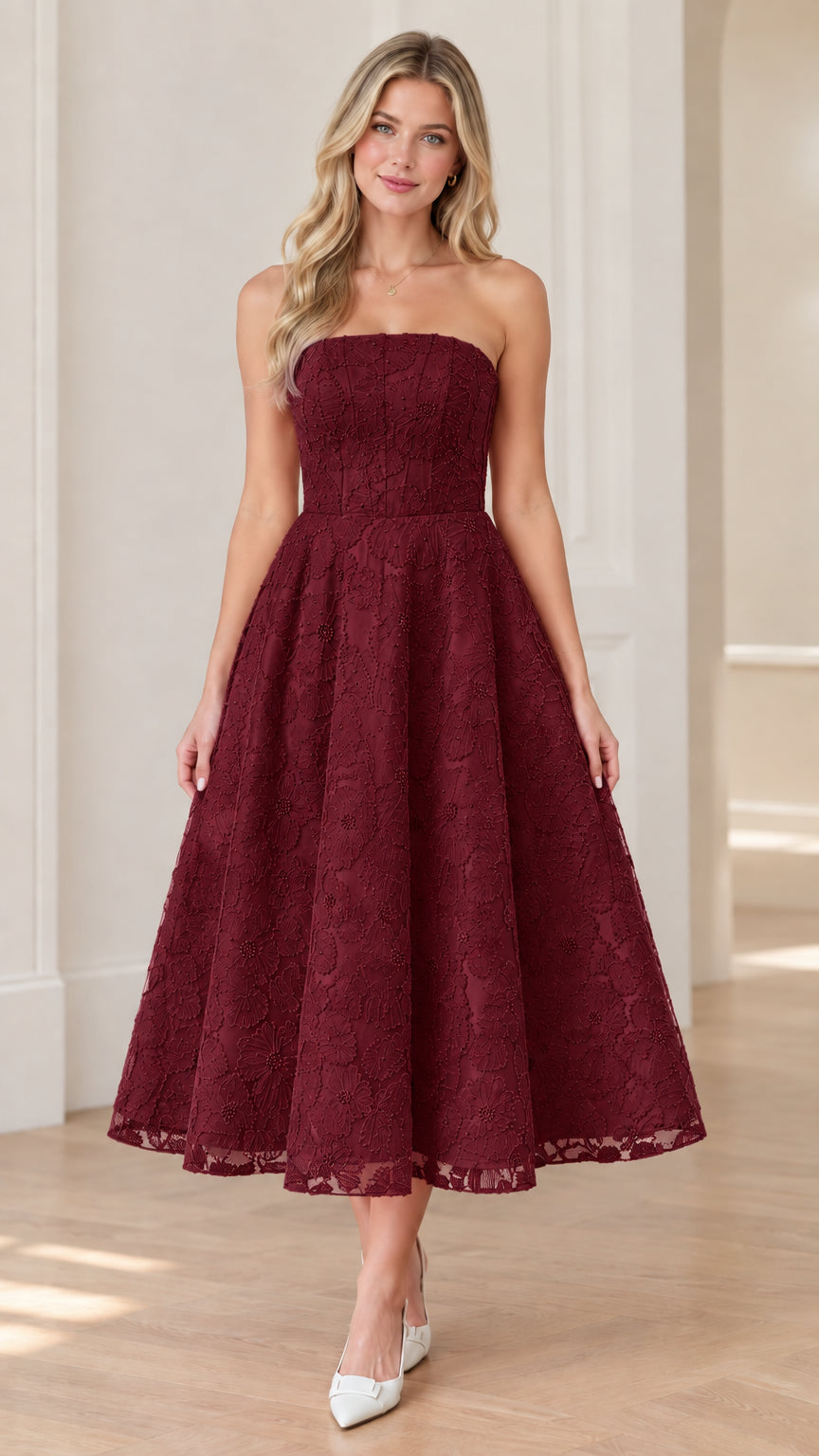 Front view of woman wearing strapless burgundy floral lace midi dress