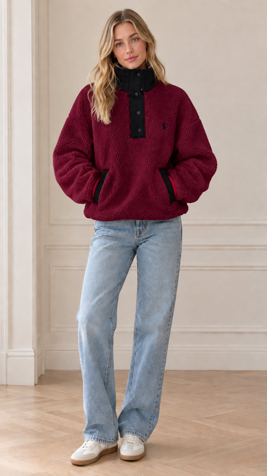 Front view of model wearing burgundy sherpa fleece snap-neck pullover