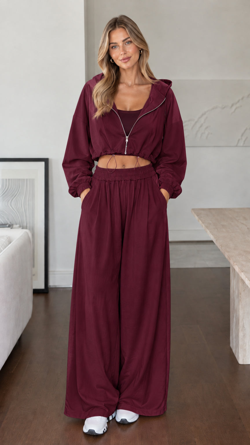 Model wearing burgundy wine cropped hoodie and wide-leg lounge set