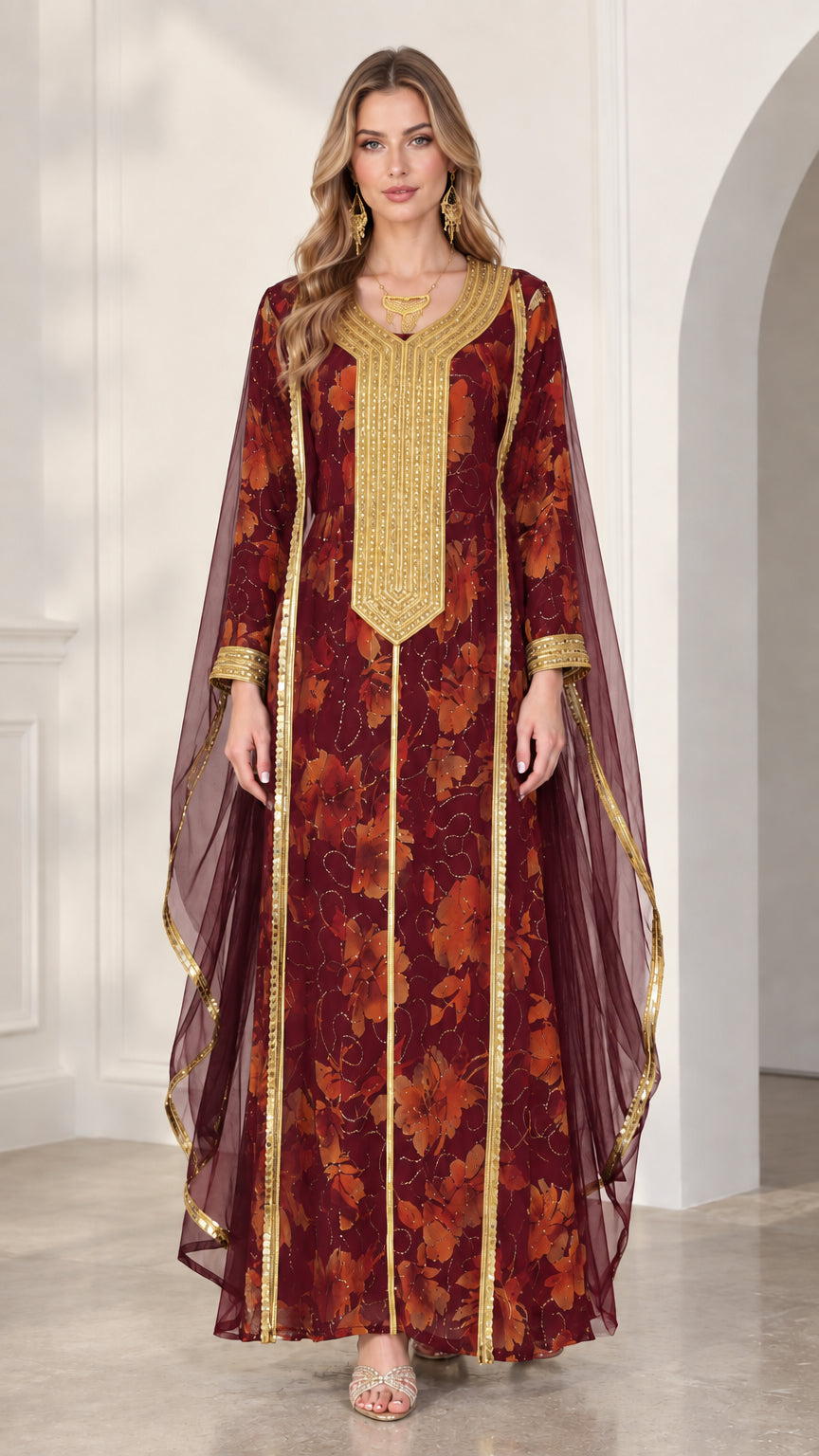 Model wearing burgundy floral kaftan dress with gold bib embroidery and sheer draped sleeves