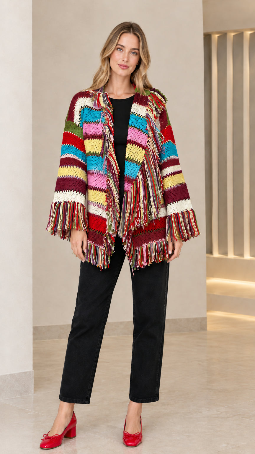Model wearing burgundy multicolor striped fringe knit cardigan