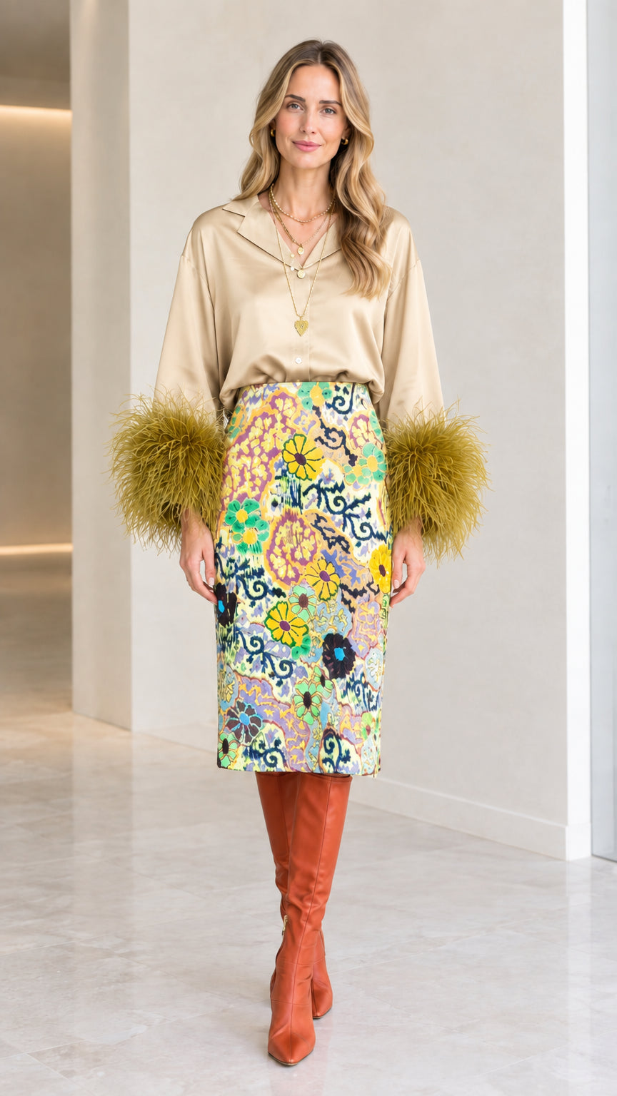 Champagne beige satin top with contrasting olive feather cuffs and floral skirt