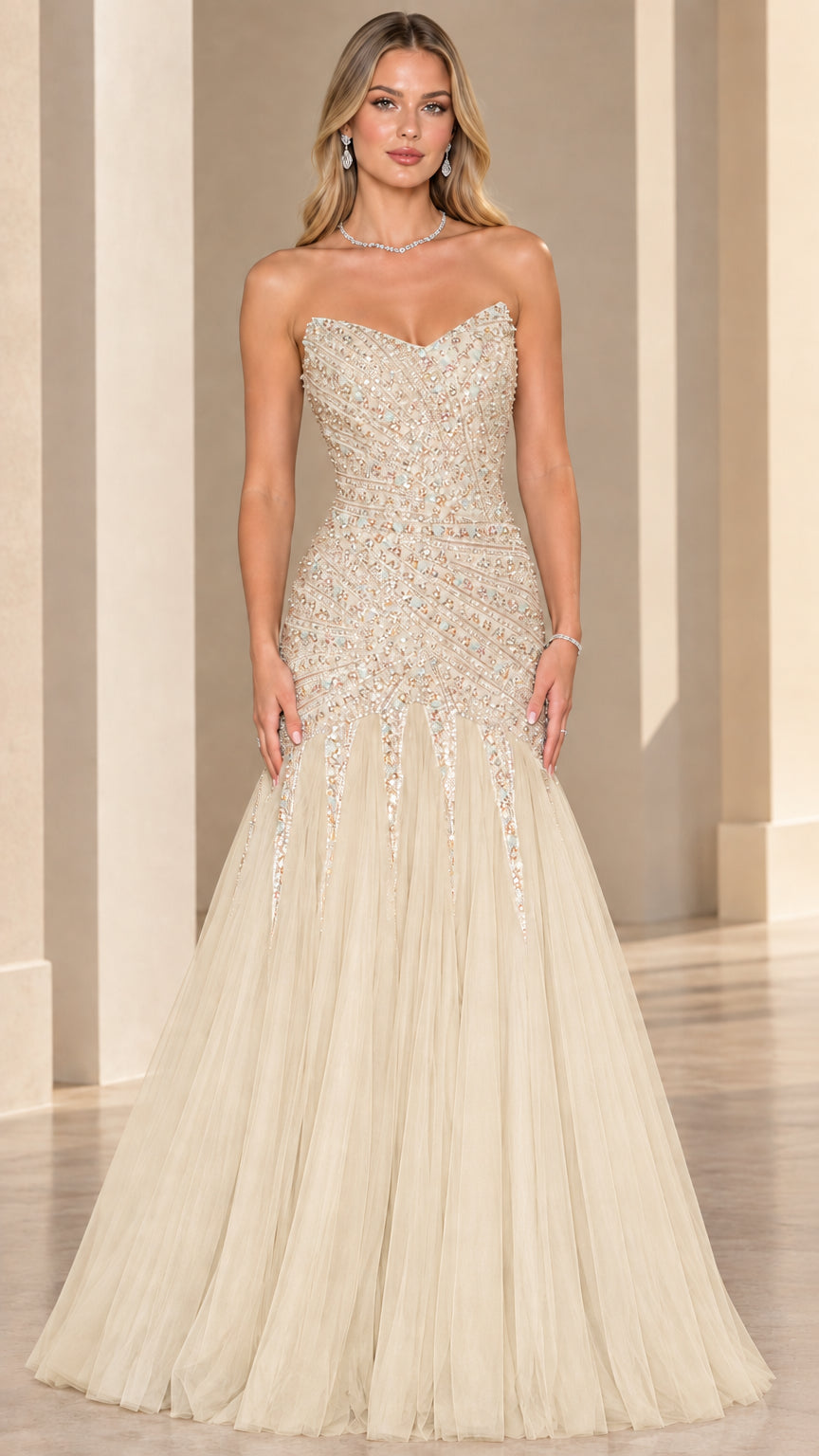 Front view of model wearing champagne gold strapless beaded mermaid formal gown