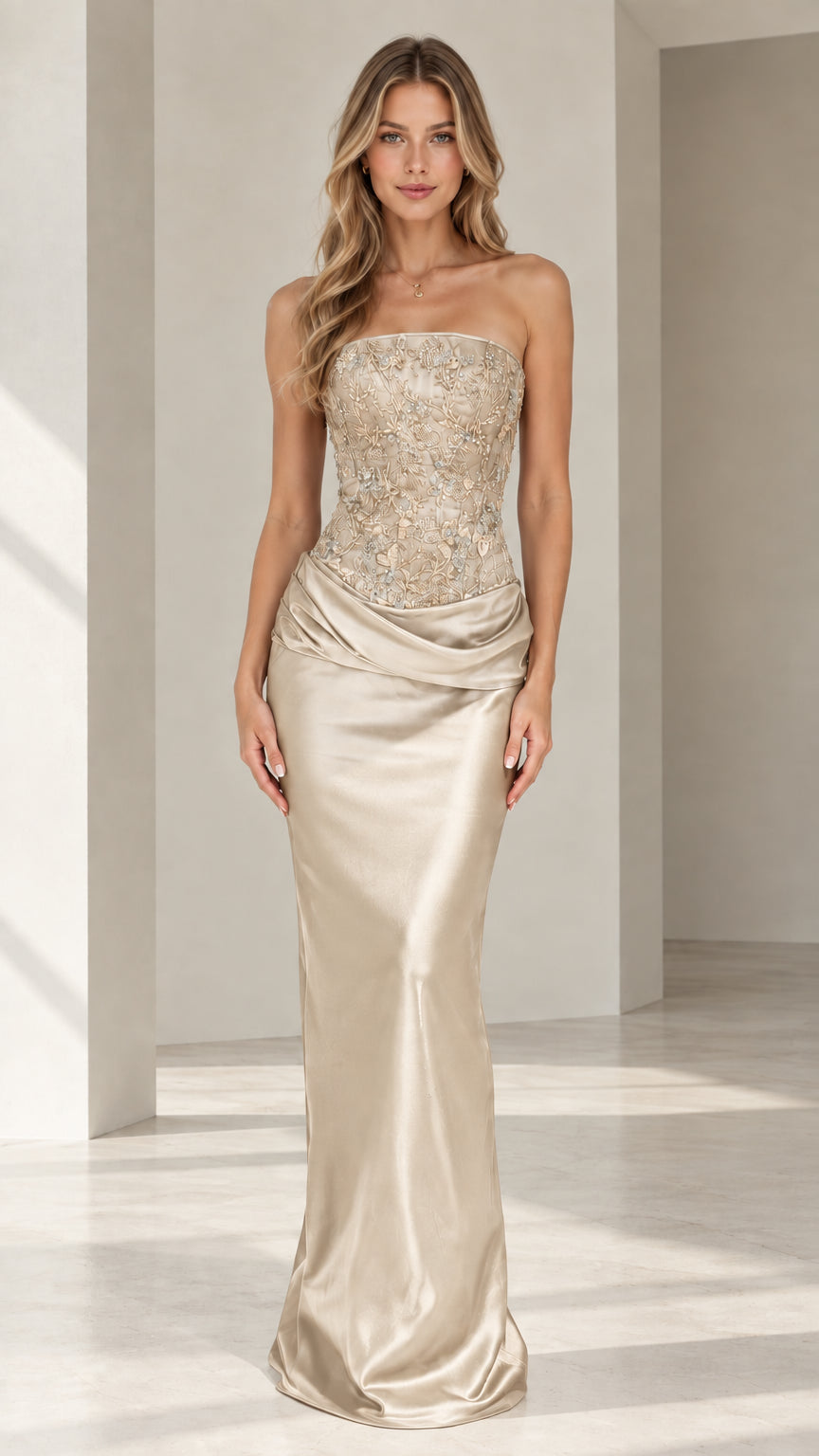 Model wearing champagne gold strapless beaded corset satin evening gown