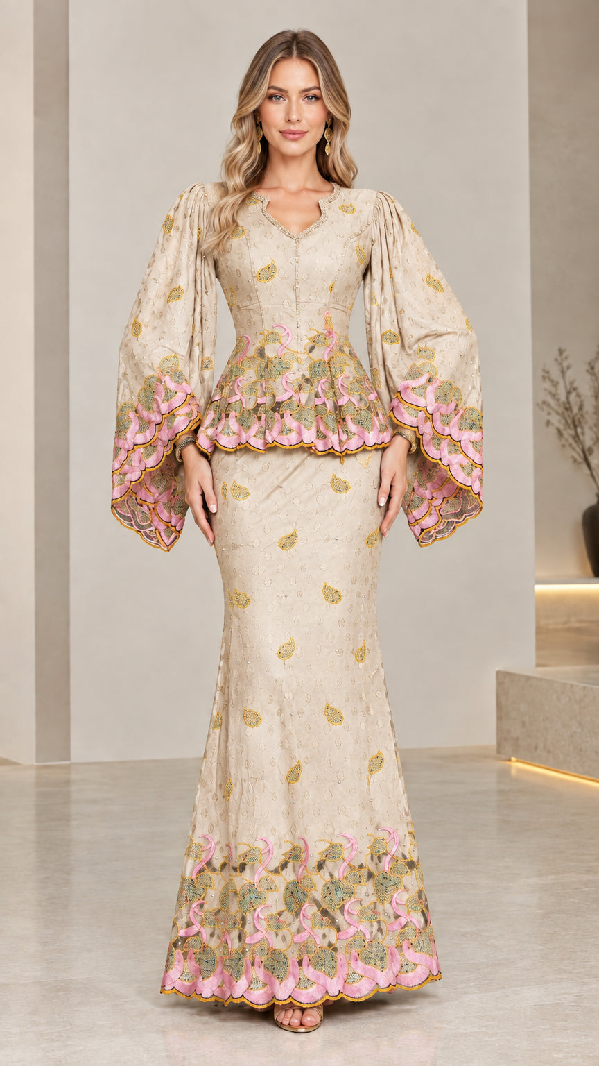 Front view of model wearing champagne beige embroidered peplum maxi dress set