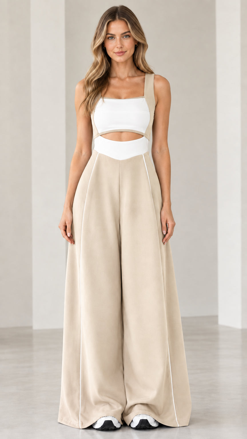 Front view of woman wearing beige sand colorblock cutout wide-leg jumpsuit