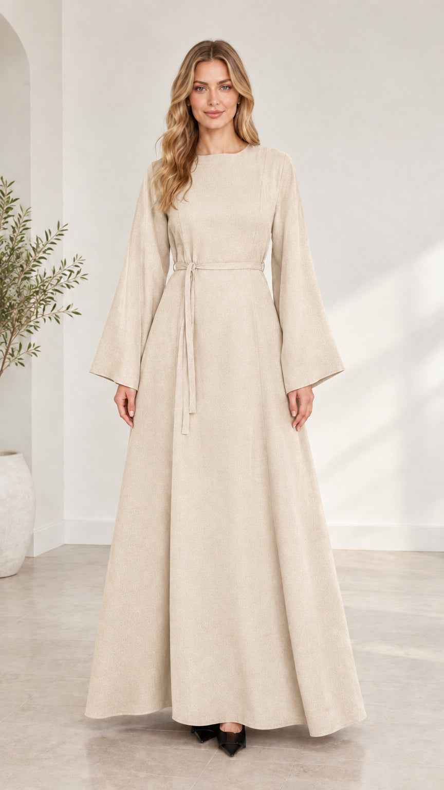 Full-length front view of woman wearing beige cream long bell sleeve modest maxi dress