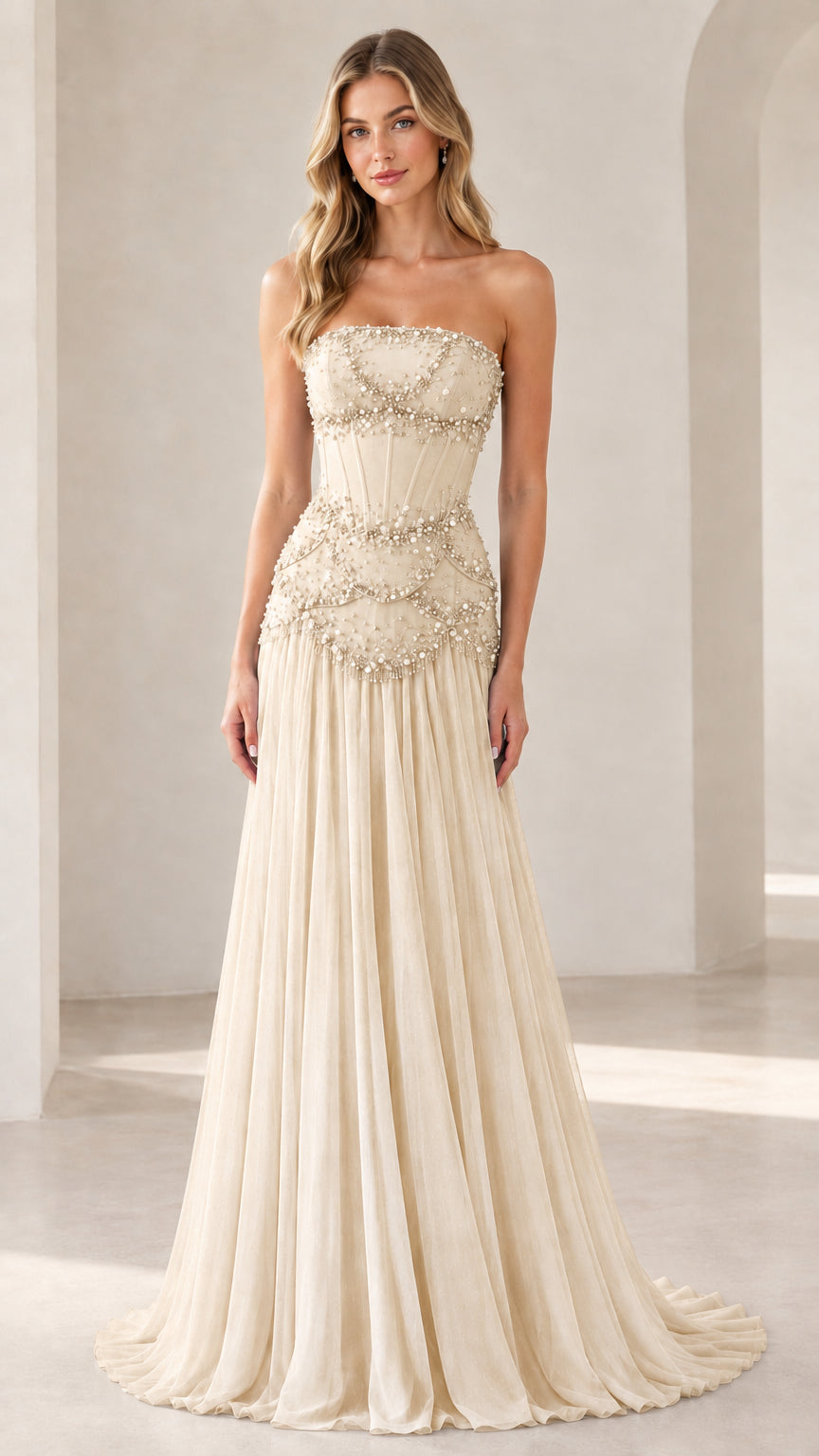 Model wearing champagne cream strapless corset evening gown