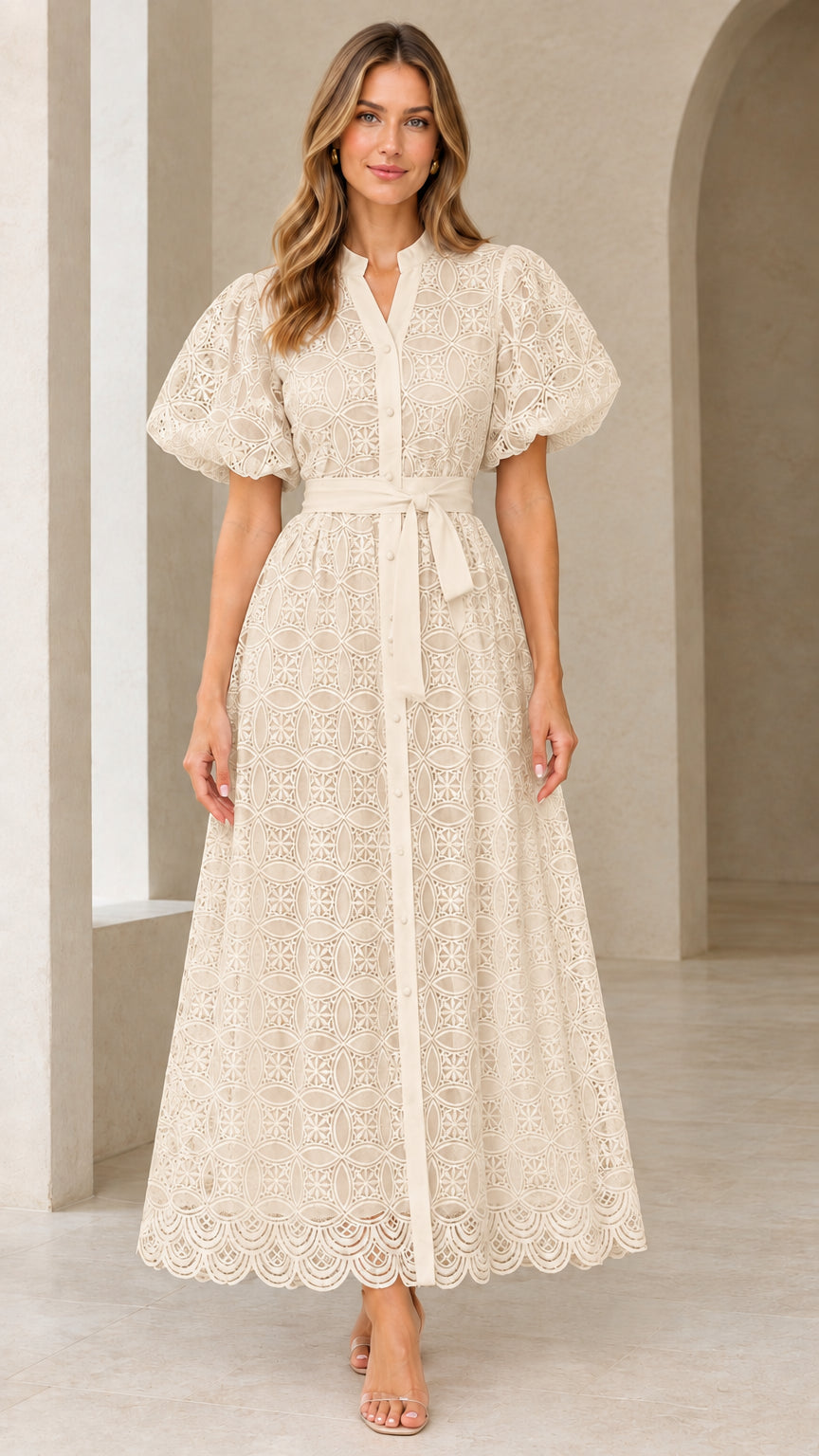 Front view of model wearing beige cream embroidered eyelet lace maxi dress