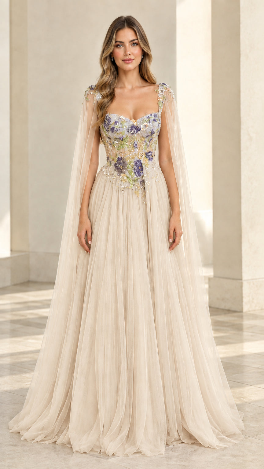 Champagne cream embroidered tulle evening gown with flowing cape details