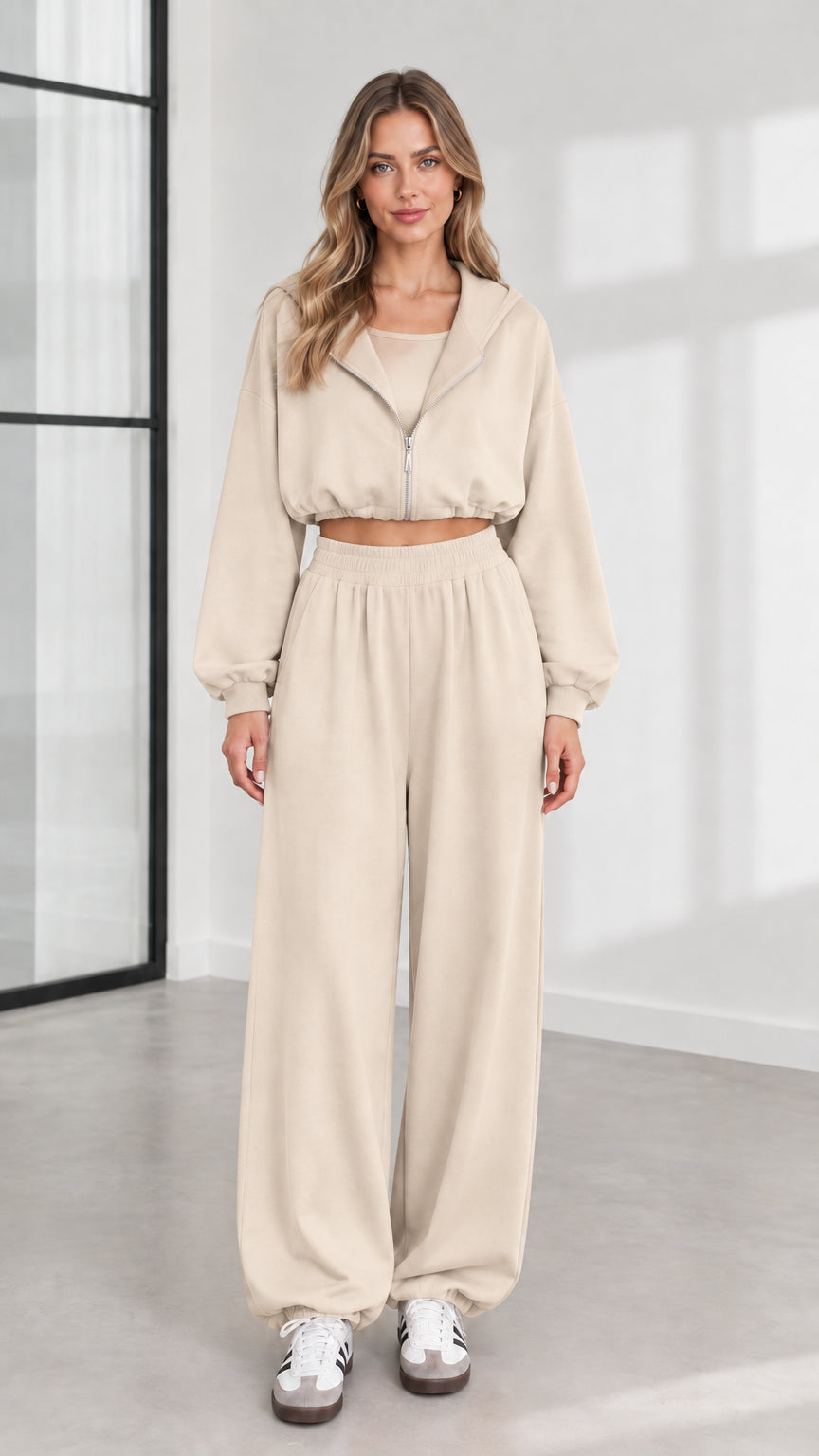 Front view of model wearing beige 3-piece cropped zip hoodie and wide-leg lounge set