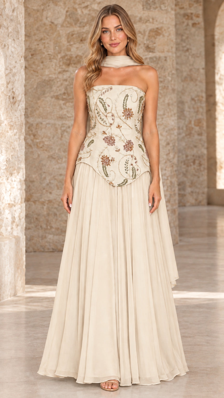 Front full view of champagne ivory strapless chiffon gown with embroidered bodice