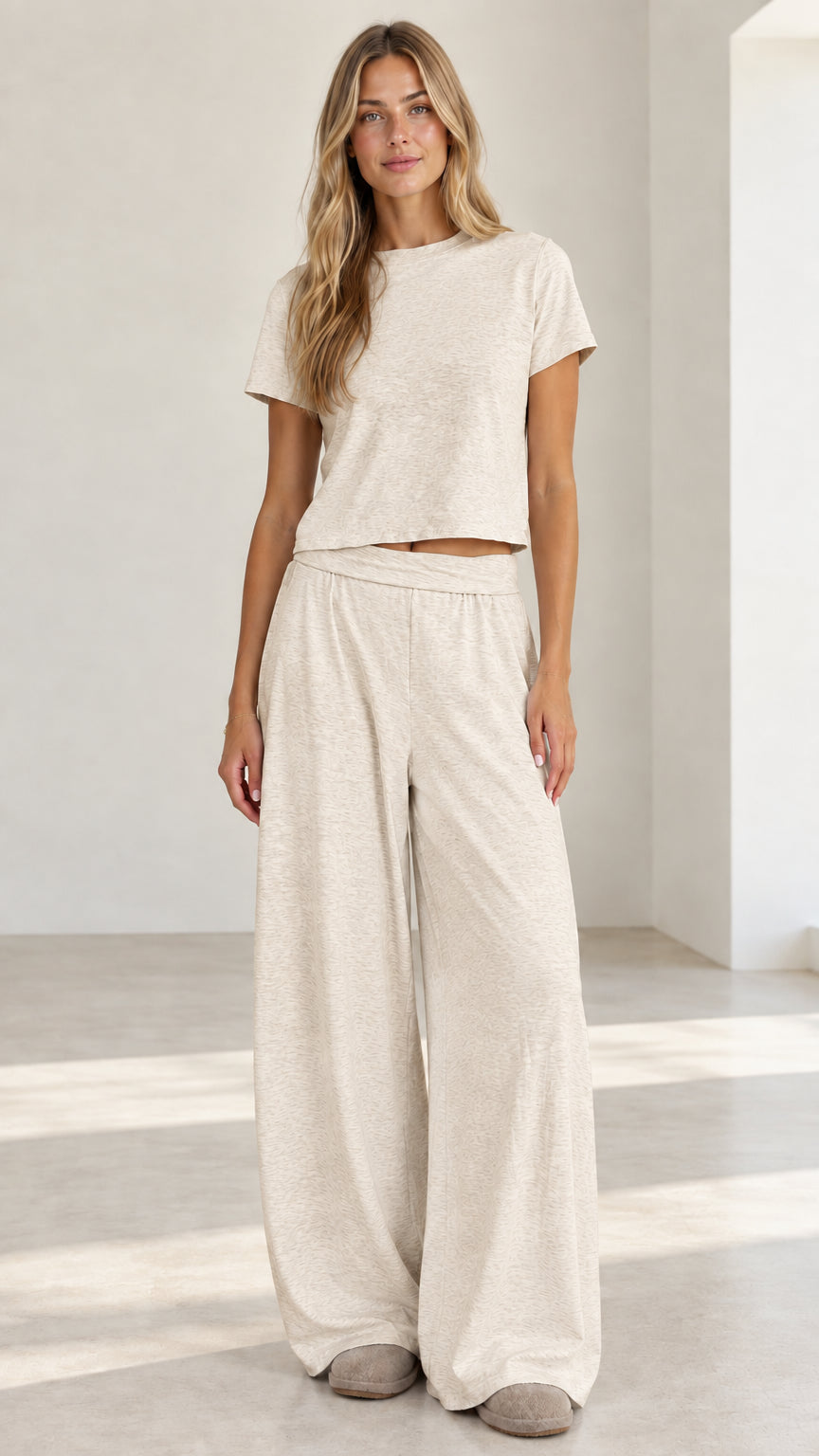 Model wearing oatmeal cream short sleeve crop top and wide leg lounge set