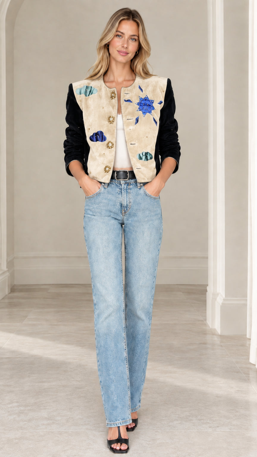 Model wearing beige celestial applique cropped jacket with black velvet sleeves