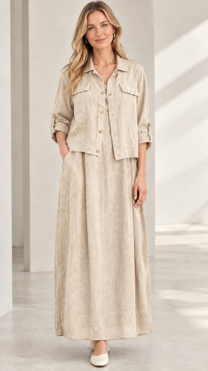Model wearing beige natural sand colored two-piece shirt and maxi skirt set