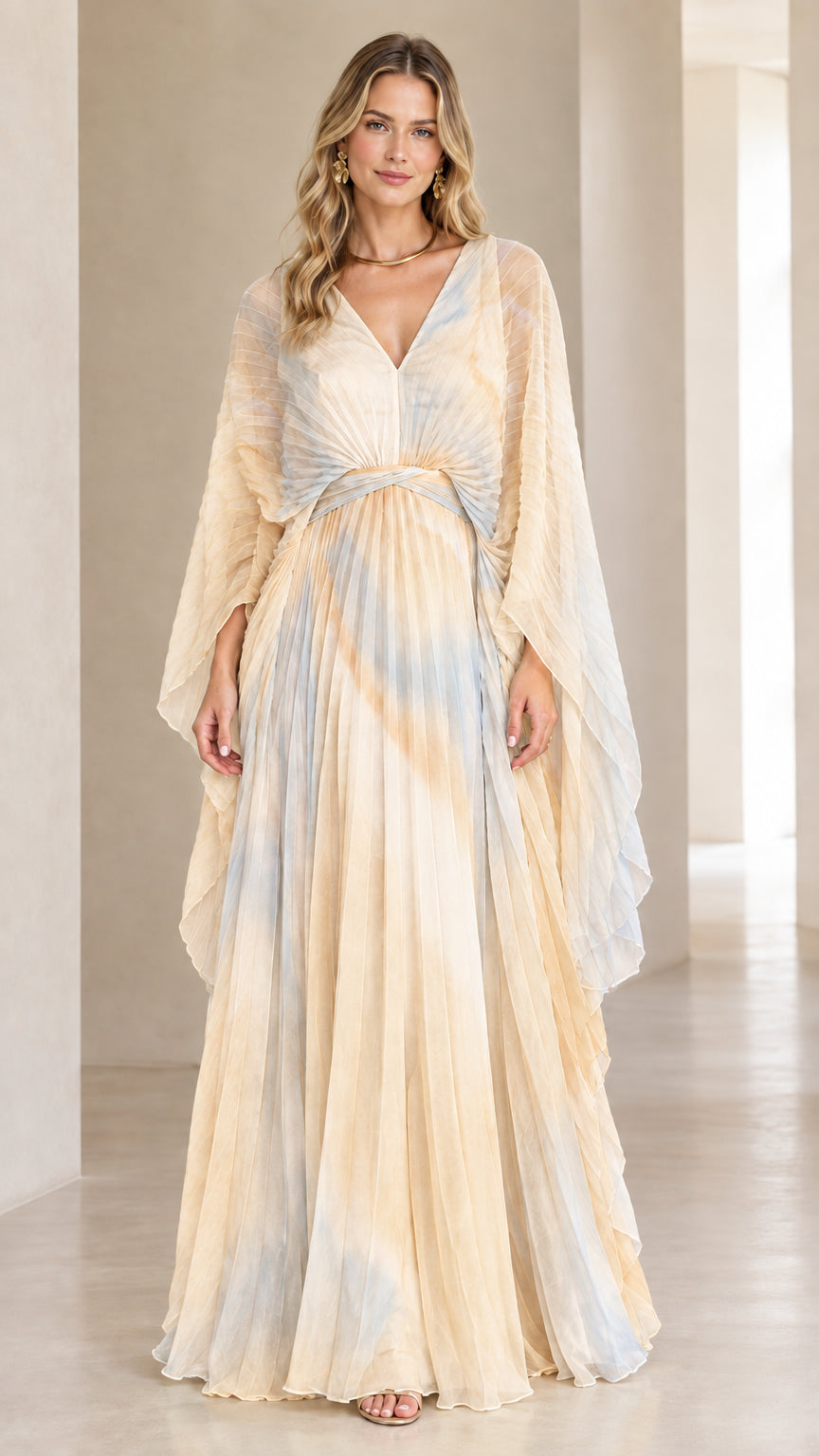 Front view of model wearing champagne and blue ombre pleated cape sleeve maxi dress