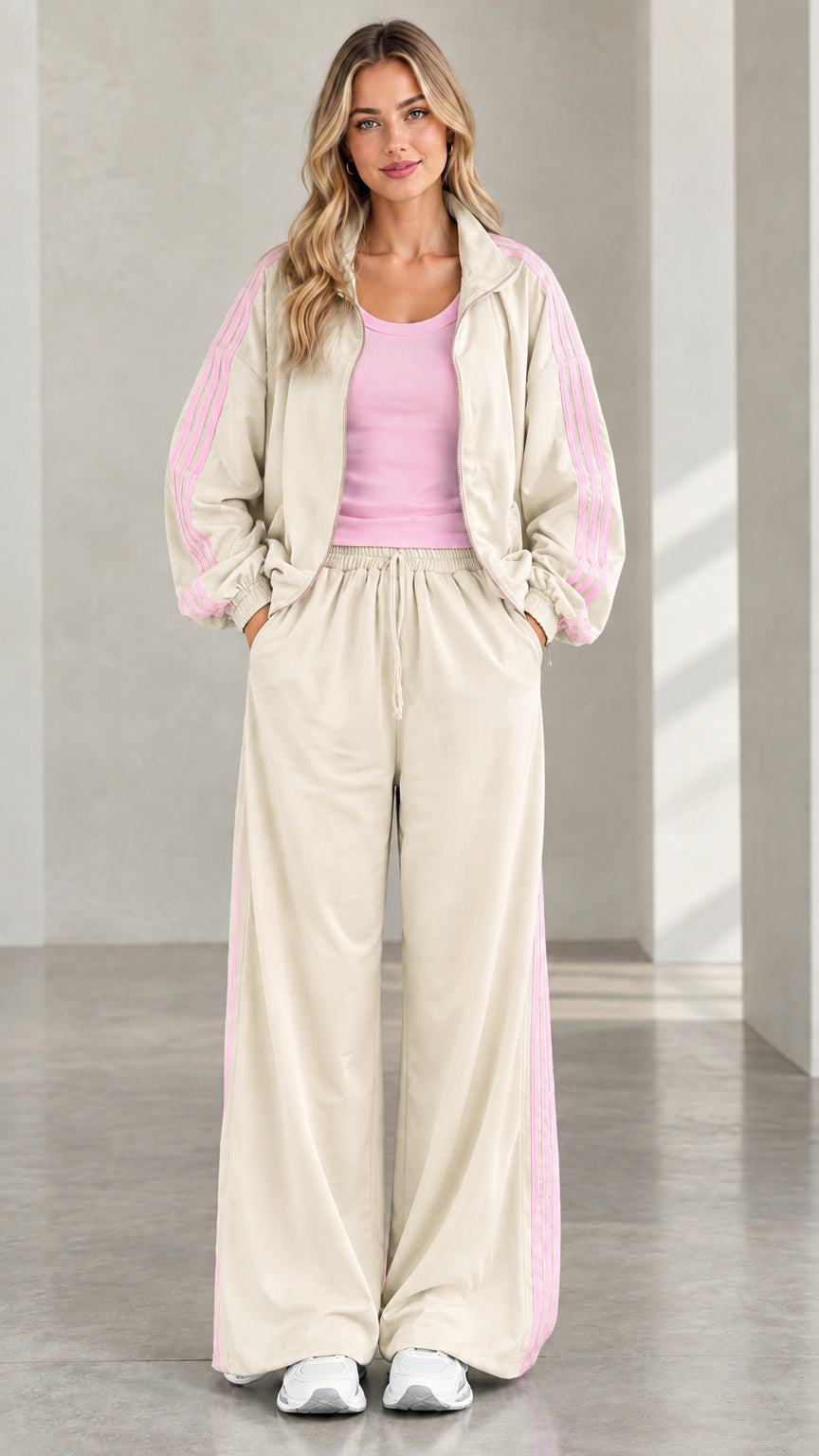 Front view of model wearing beige tracksuit set with pink side stripes