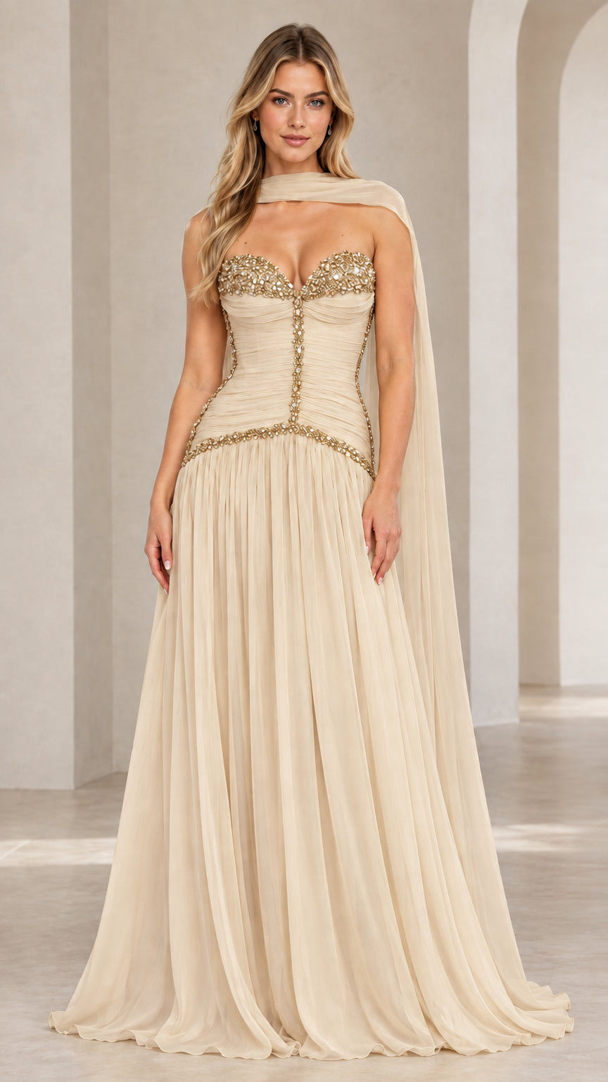 Model wearing champagne beige strapless embellished corset chiffon evening gown with matching neck scarf