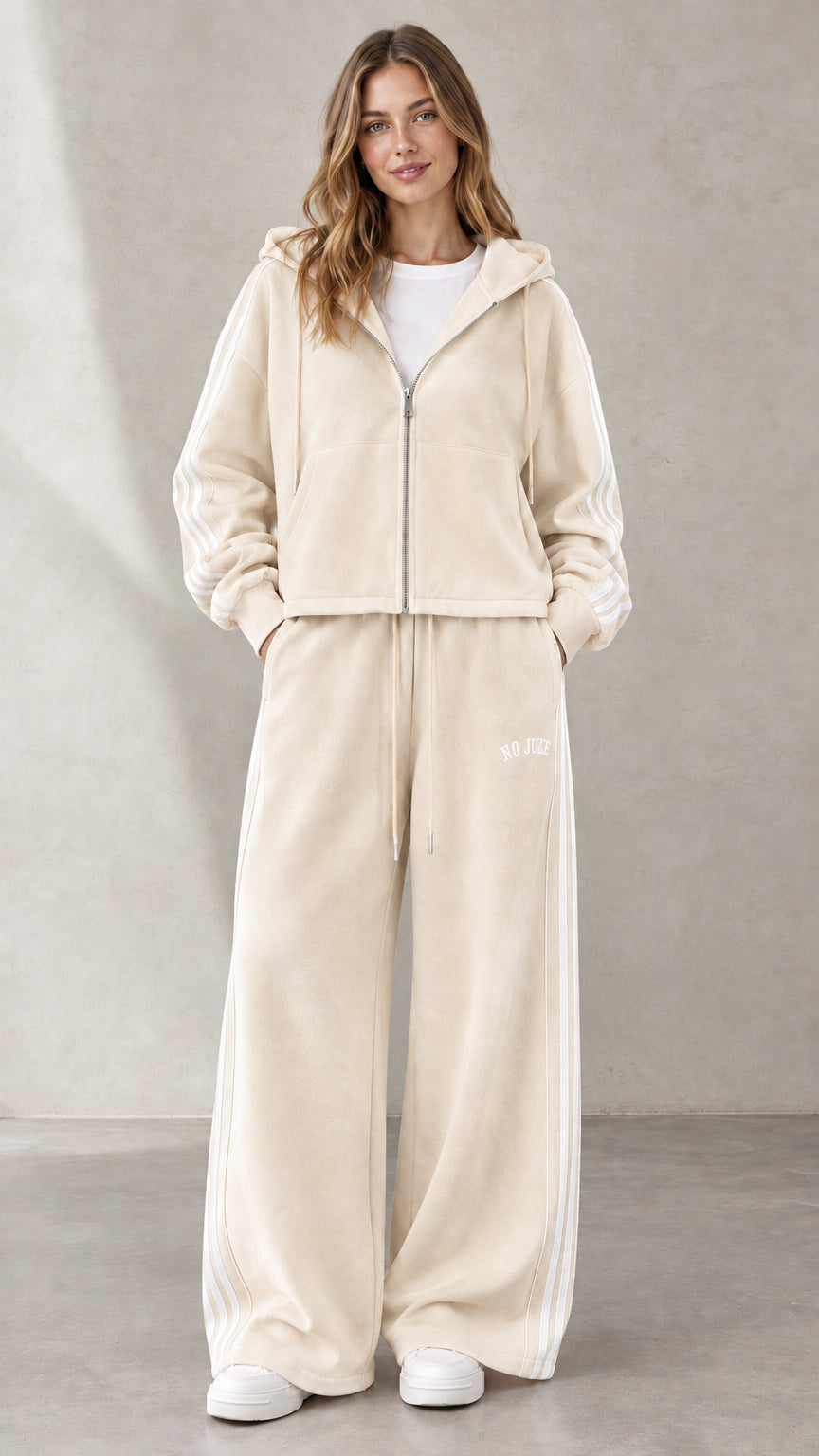 Woman wearing Cream beige two-piece zip hoodie and wide-leg track set