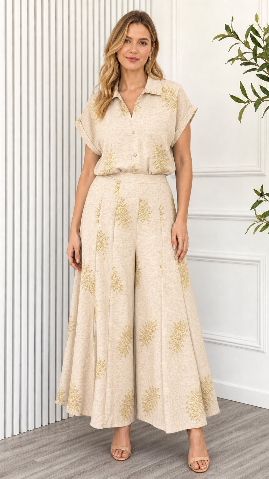 Model wearing beige leaf print two piece set