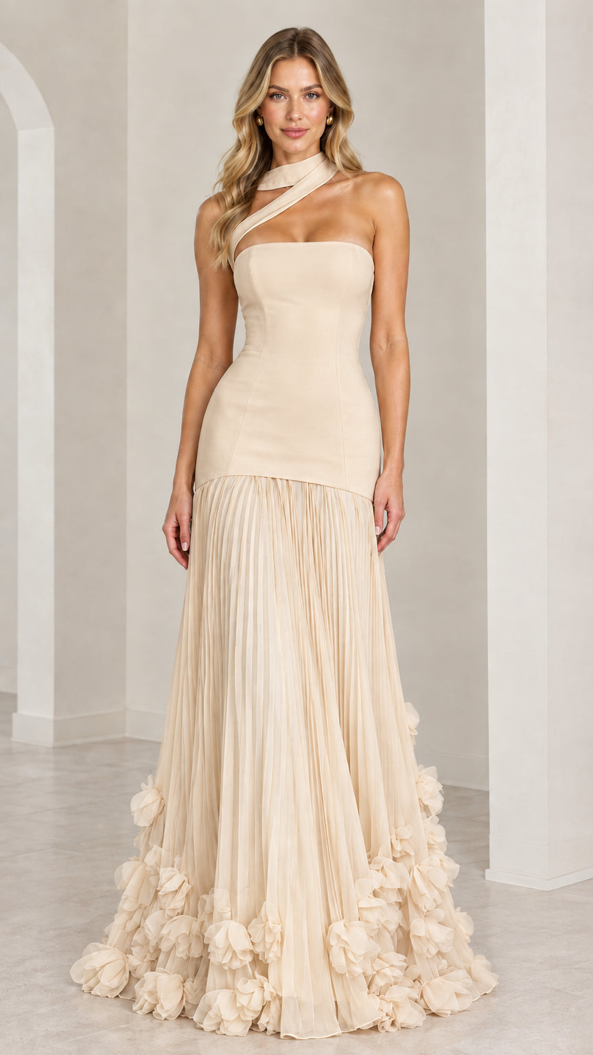 Model wearing the champagne beige asymmetric pleated drop-waist evening gown