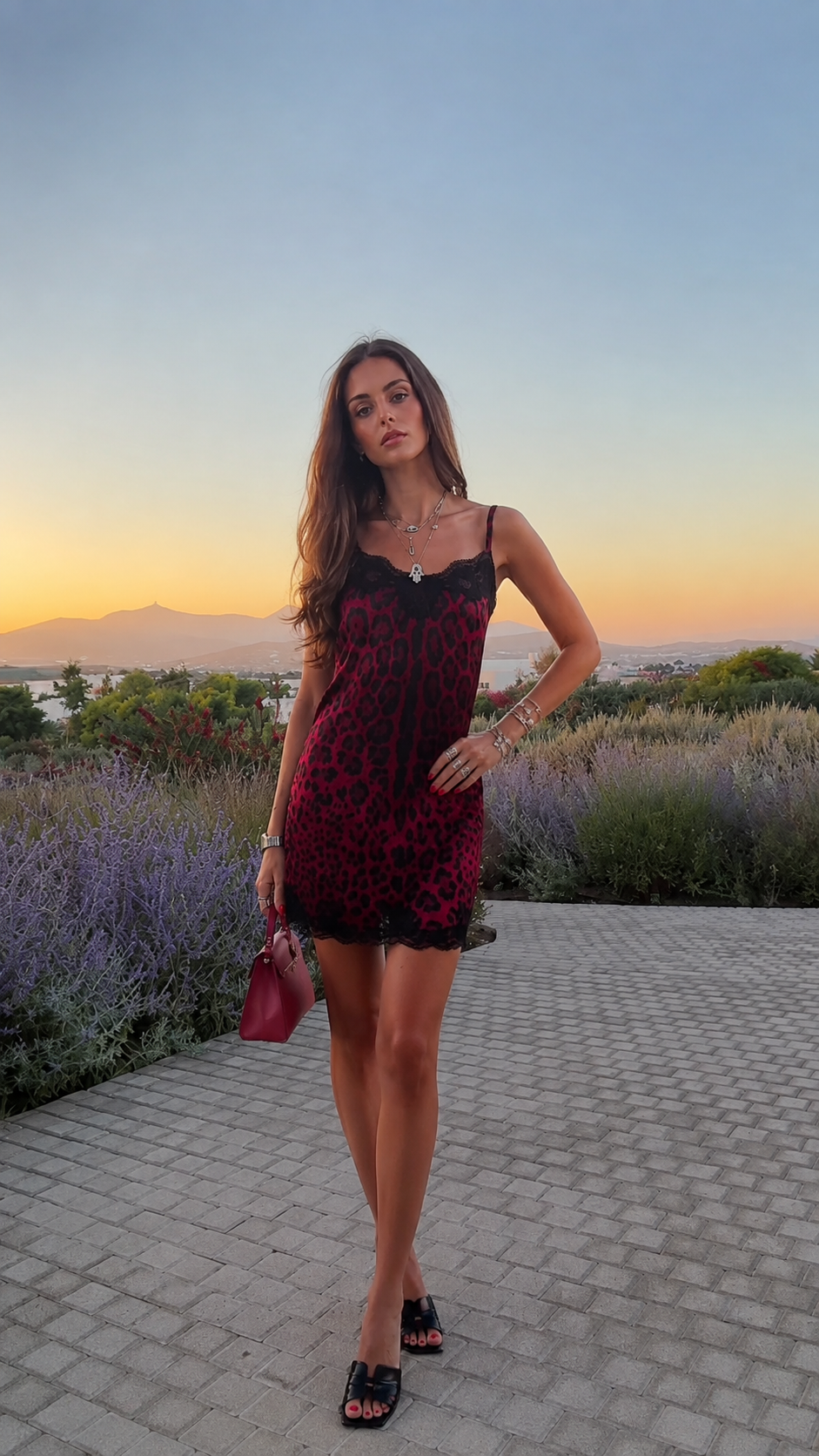 Woman posing in burgundy leopard print lace slip dress